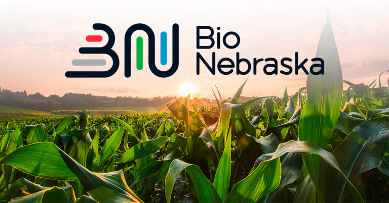 Bio Nebraska logo against sunny corn field